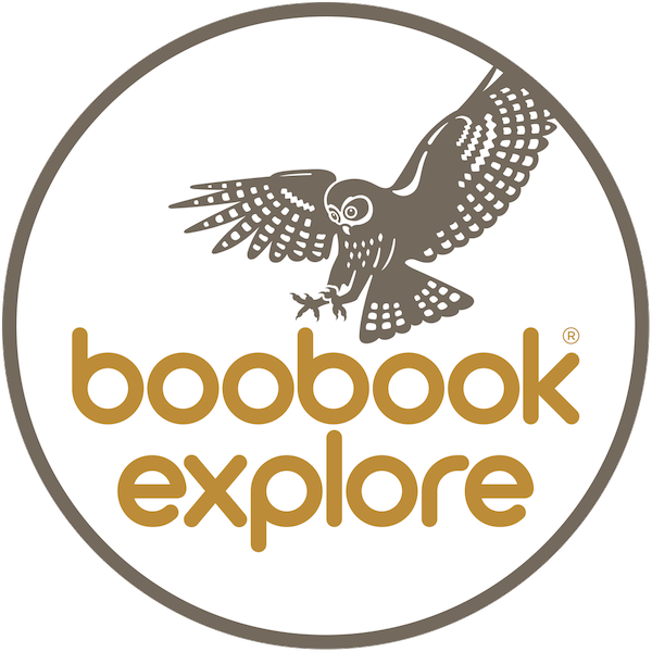Circular logo featuring a stylized owl in flight above the words 