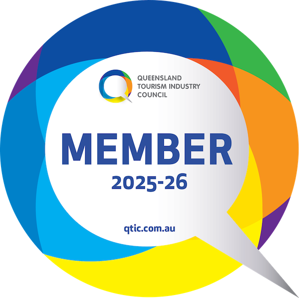 Queensland Tourism Industry Council member badge for 2025-26, featuring a colorful speech bubble design and website qtic.com.au.