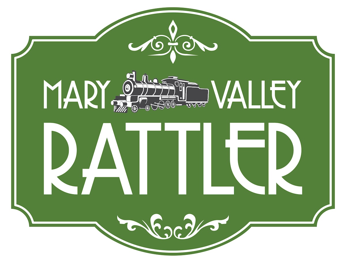 Green sign with decorative border, image of a steam locomotive, and the text 