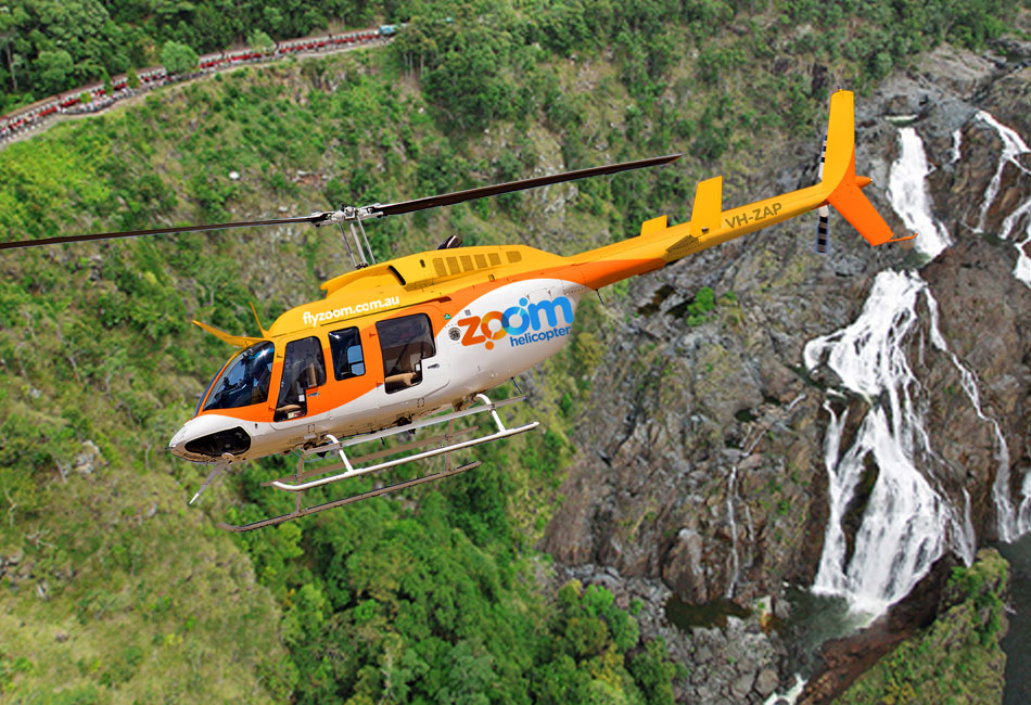 A yellow and white Zoom Helicopter flies over a green landscape with a waterfall and a train visible in the background.